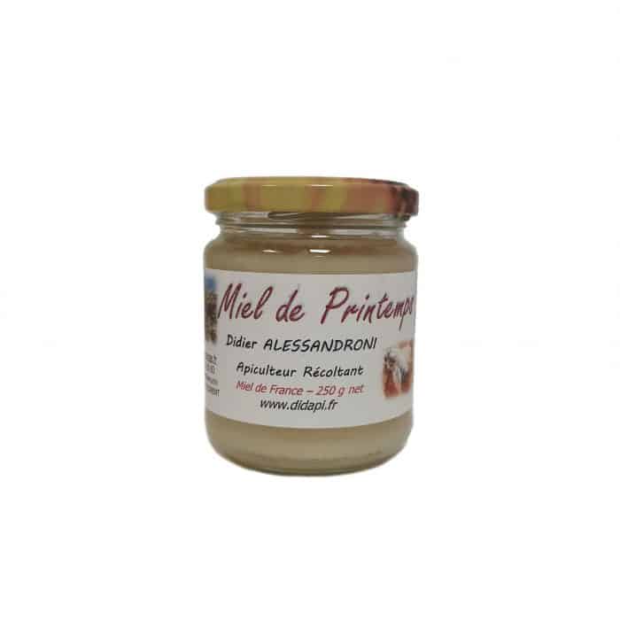 Pot en verre 250g de miel de printemps également appelé miel du gâtinais et composé en grande majorité de miel de colza.